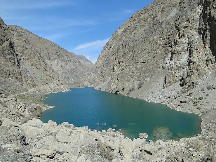 Turquoise lake among the rugged mountains of Tajikistan's Fann range